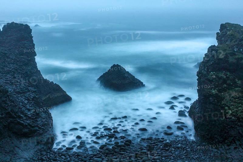 Stormy coastal landscape of Arnarstapi at night, Iceland