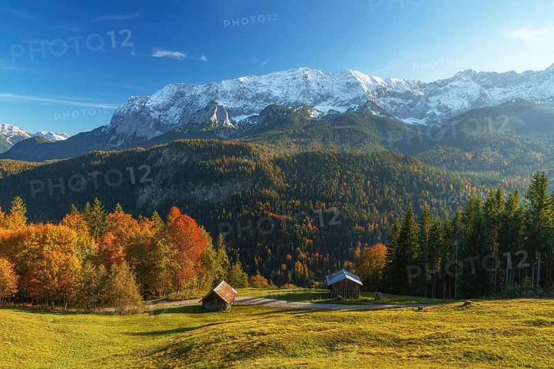 Fall colors and snow on the mountain peak near garmisch partenkirchen. Taken from Mountain Eckbauer. Background mountains are Wettersteinwand