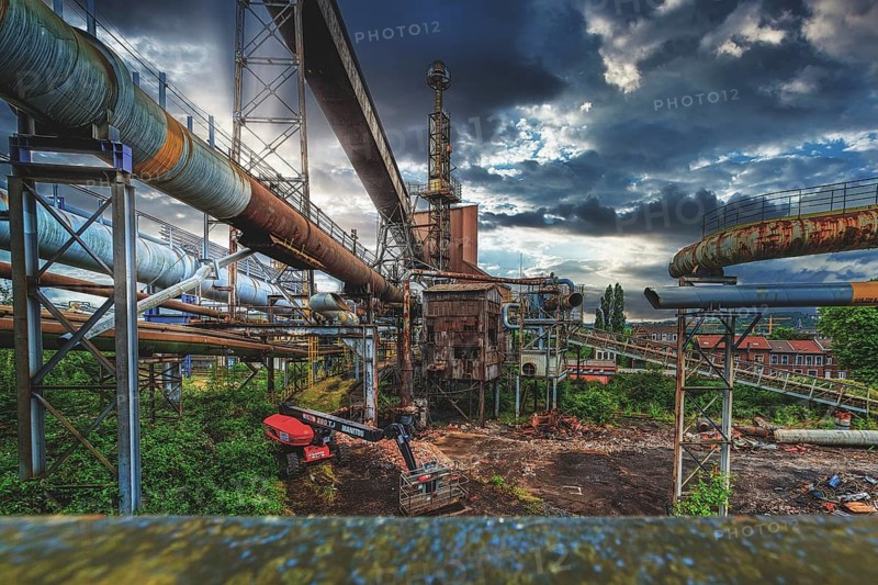 Complex industrial plant with rusted pipes and dilapidated building under a cloudy sky, HF6, Lost Place, Seraing, Province of Liège, Belgium