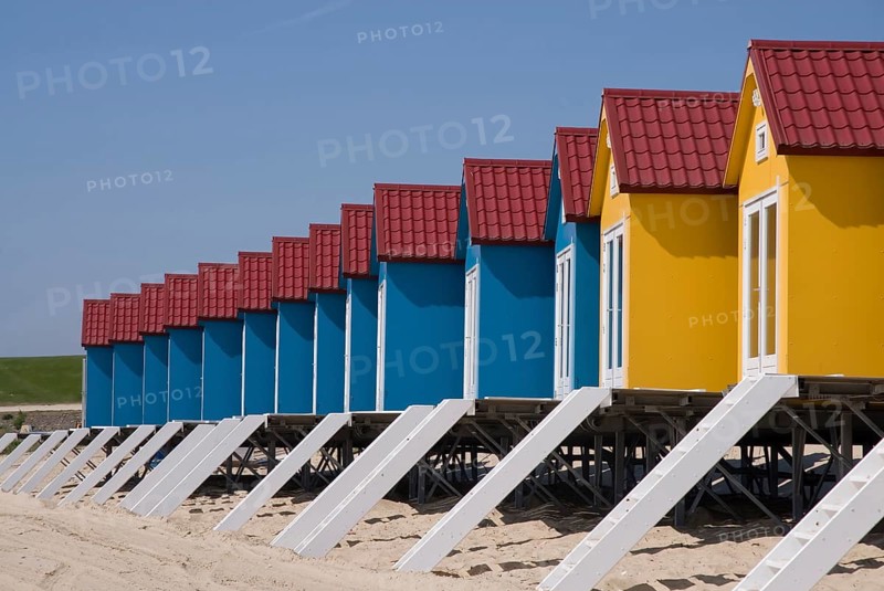 Colored blue and yellow houses on the beach