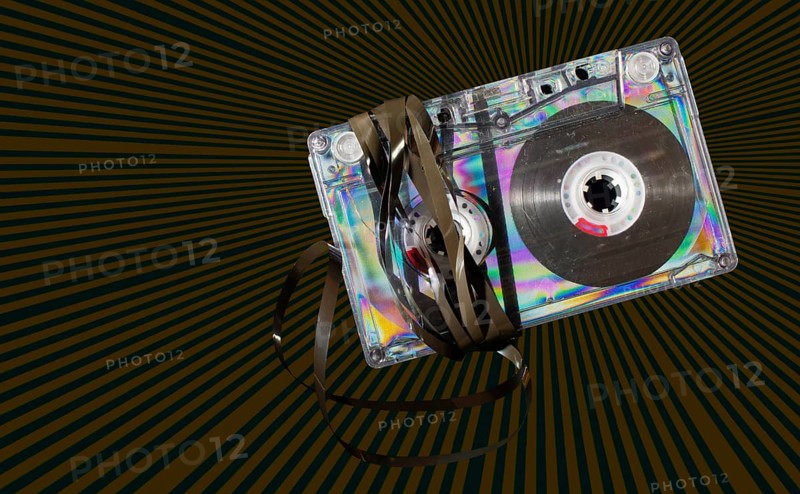 Vintage cassette tape on vintage rays background