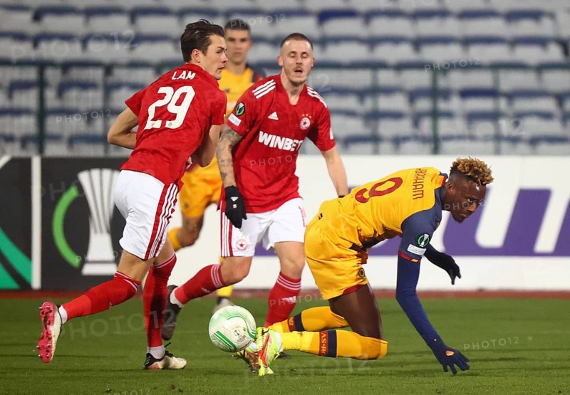 Sofia, Bulgaria - 9 December, 2021: CSKA Sofia's Thomas Lam (L) in action with Roma's Tammy Abraham (R) during the UEFA Europa Conference League group C soccer match between CSKA Sofia and AS Roma