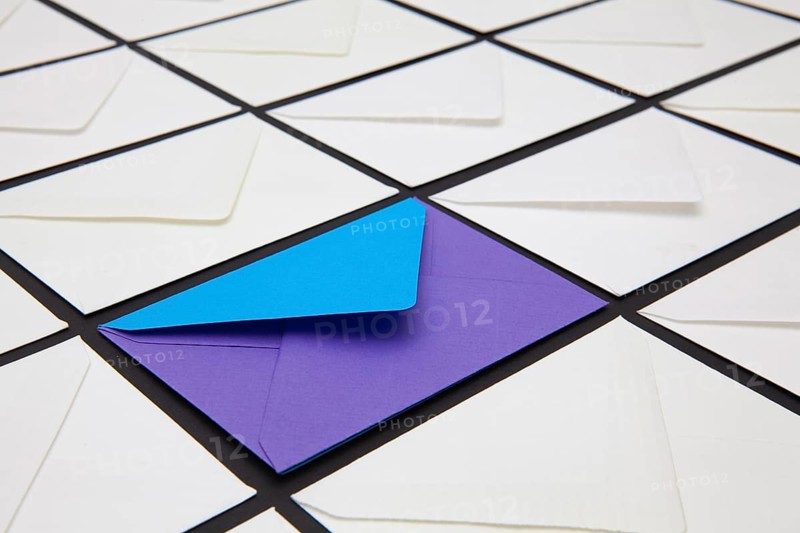 Composition with white and colored envelopes on the table. The photo suitable for various holidays and anniversaries