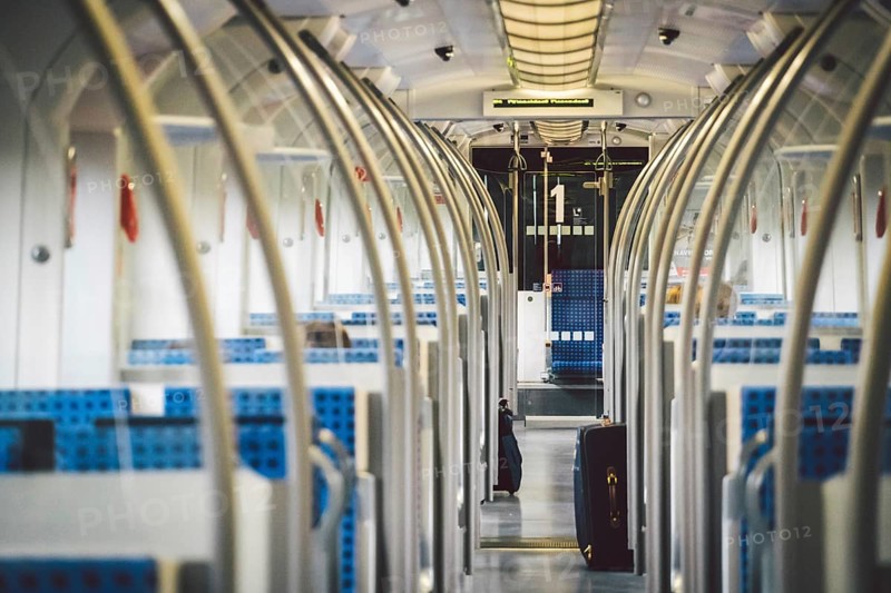 Inside The Wagon Train Germany, Dusseldorf. Empty train interior. interior view of corridor inside passenger trains with blue fabric seats of German railway train system