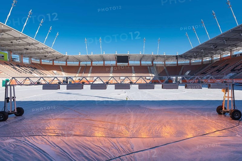 LUBIN, POLAND - MARCH 19, 2018: Stadium Zaglebie with covered turf to protect against frost and lighting grass in shaded areas. Football World Championship U-20 on 2019 will be played at the stadium