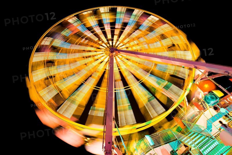 Turning illuminated ferris wheel shot at long exposure