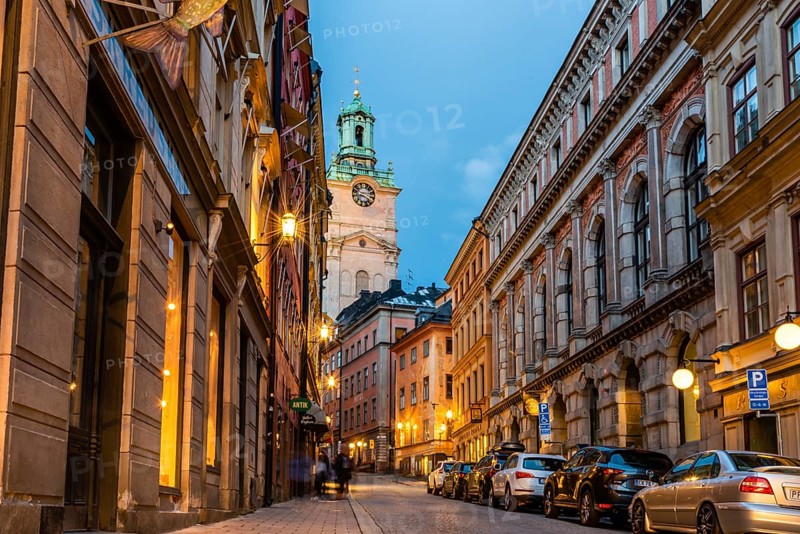 Stockholm, Sweden, August 8, 2019: Scenic view of empty cobblestoned street in Gamla Stan at sunset, the Old Town is one of the largest and best preserved medieval city centers in Europe