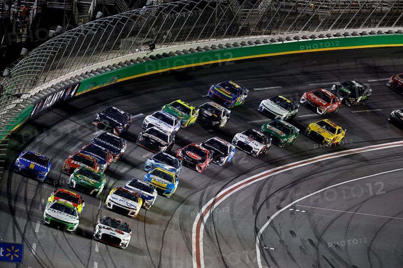 NASCAR Cup Driver, AJ Allmendinger (16) races off turn four during the Quaker State 400 Available at Walmart at the Atlanta Motor Speedway in Hampton GA
