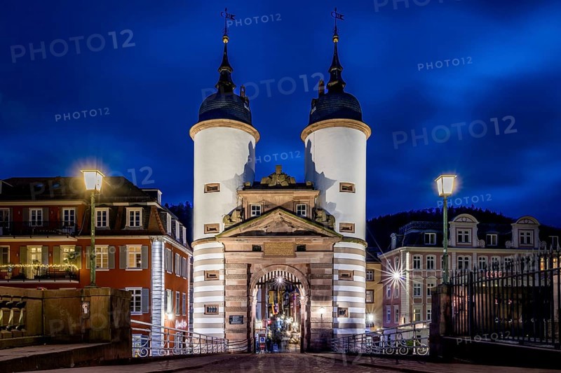 Night view of Heidelberg with illuminated castle and bridge over the Neckar, Old bridge in Heidelberg on the Neckar, Illuminated castle and bridge over the Neckar in an atmospheric night shot of Heidelberg, Old bridge in Heidelberg on the Neckar bridge gate