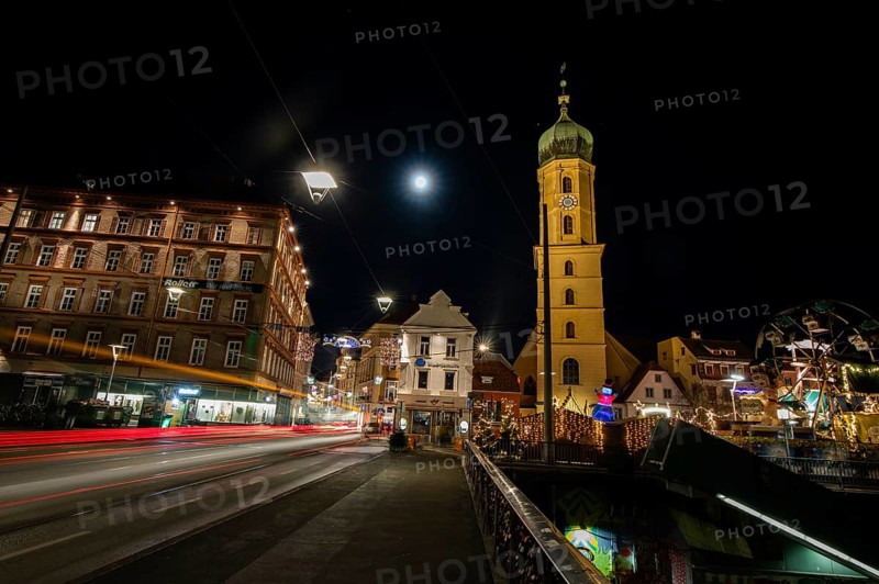 Christmas illuminated Mur bridge, behind Frnziskanerkirche, light trails, night shot, Graz, Styria, Austria