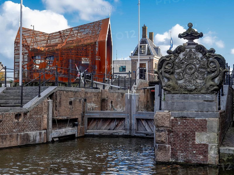 Lock complex with the historic start of the lock next to the modern building Open-air museum Hondsbossche Sluis Zaandam, Zaandam, North Holland, Netherlands