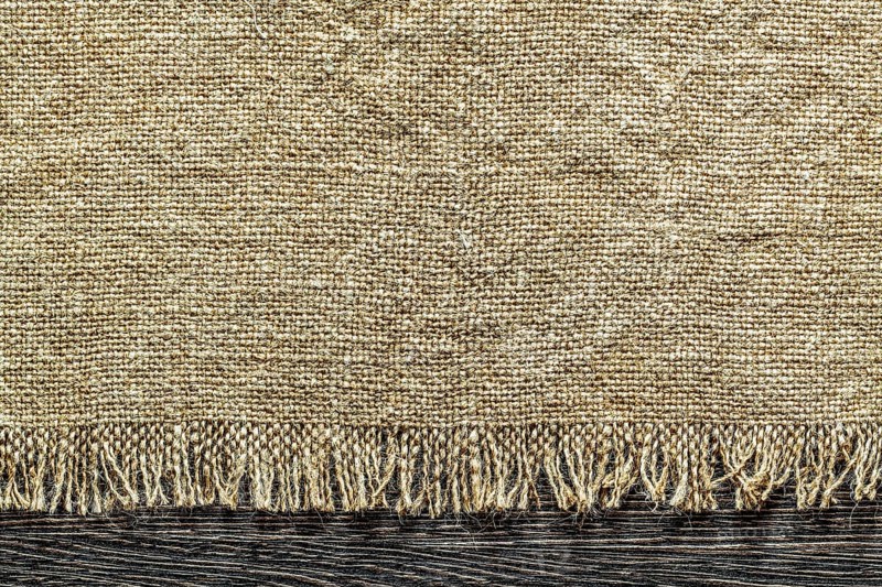 Vintage sacking fabric on wooden board