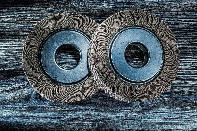 Used polishing flap discs on vintage wooden board