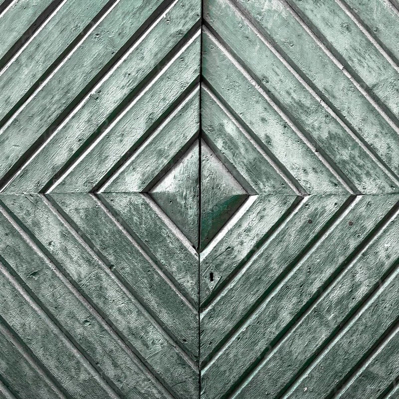 Details of an old wooden door with diamond pattern