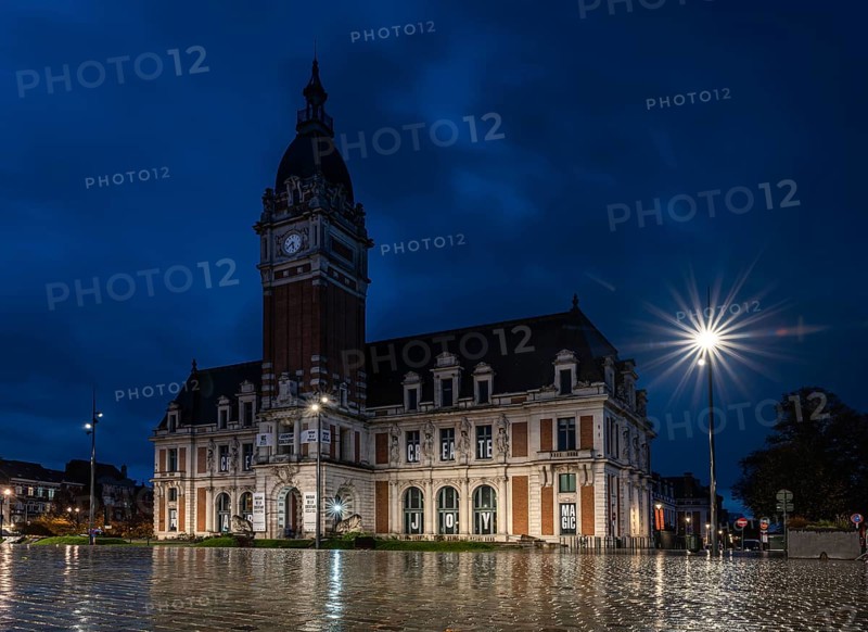 Laeken, Brussels Capital Region, Belgium- 11 09 2021: The town hall with the rain reflecting on the pavement of the square
