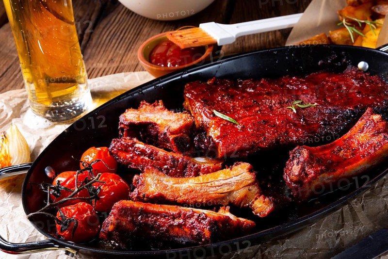 Grilled ribs in a spicy marinade with salad and vegetables