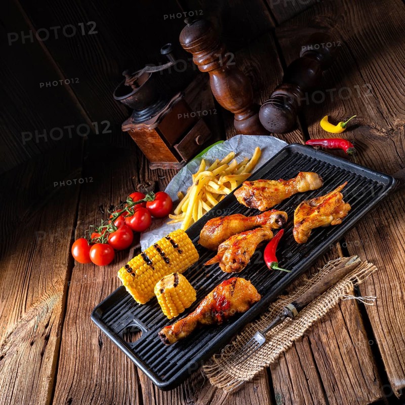 Rustic Grilled chicken wings, legs, and spicy corn