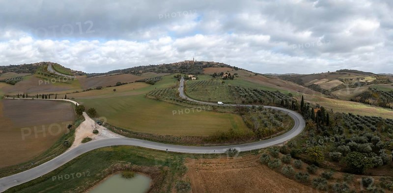 A long winding road leading to the Tuscan hilltop village of Pienza