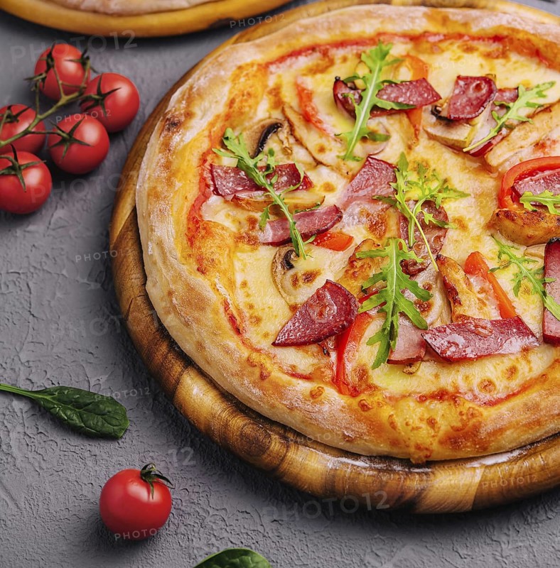 food still-life, Baked round pizza made with salami, tomatoes and mushrooms