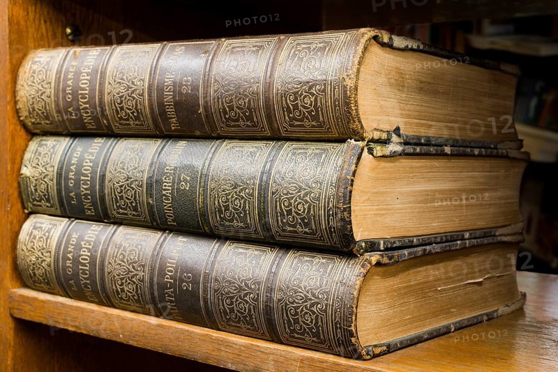 Old books on shelf. French encyclopedia. Close up shot