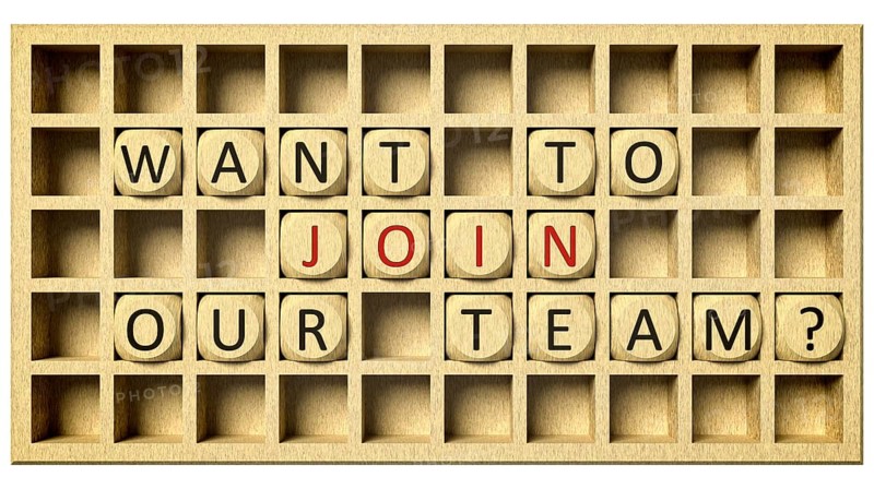 3d rendering of a wooden grid with cubes and the message want to join our team