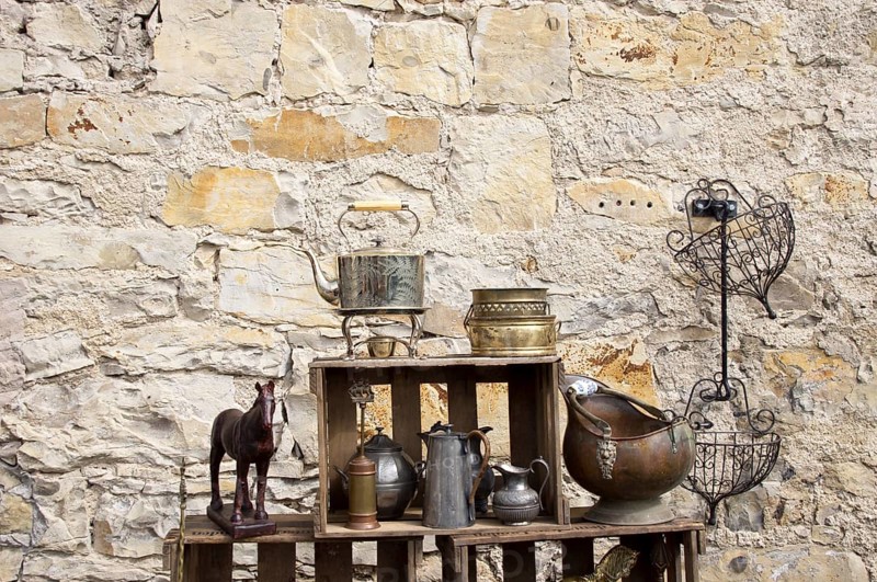 Still life in front of a natural stone wall