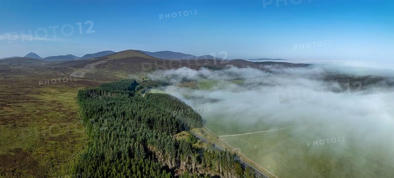 Coastal fog in the Scottish Highlands with hills, in the background prominent peak of Morven, Caithness, drone image, Broch of Ousdale, Berriedale, Scotland, Great Britain