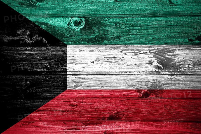Kuwait flag on wooden planks background wood flag