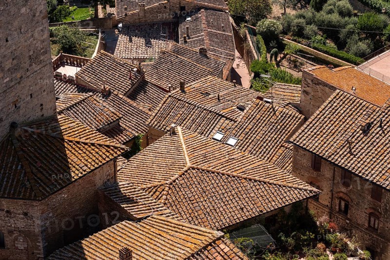 Wide panoramic view over downtown San Gimignano, seen from Torre Grosso, Italy