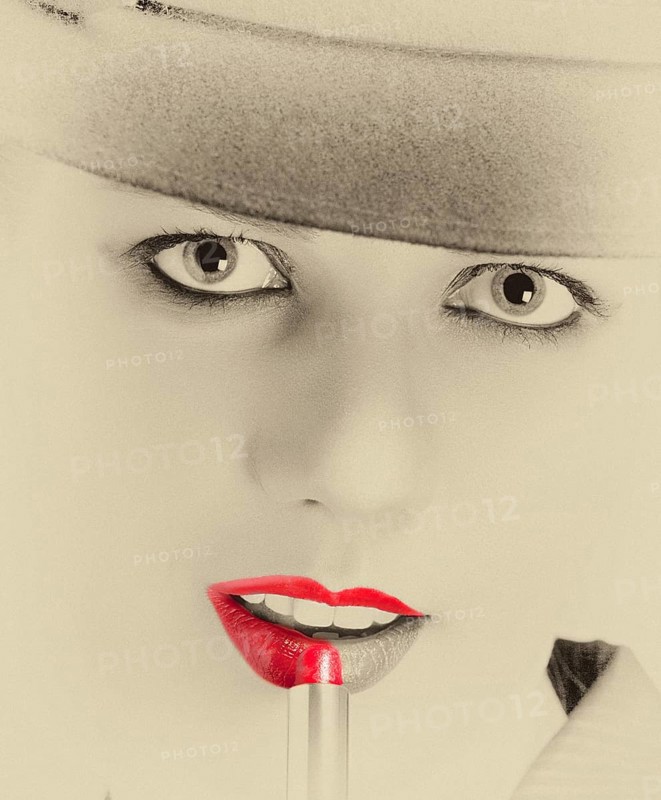 Portrait of a stylish woman with a hat and bright red lips