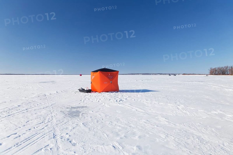 Winter, icefishing tent on the frozen Saint Lawrence River, Province of Quebec, Canada