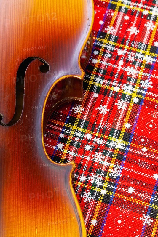 Photo of old violin on Christmas decoration. Winter holidays. Merry christmas and happy new year concept