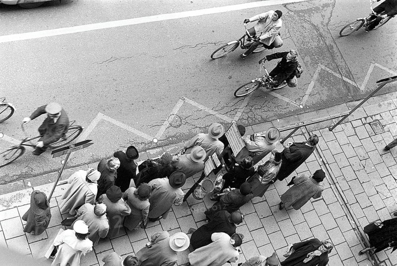 Bus stop in Stockholm in 1953. People are waiting for the bus at the bus stop. Stockholm Sweden 1953, Kristoffersson ref 1-12