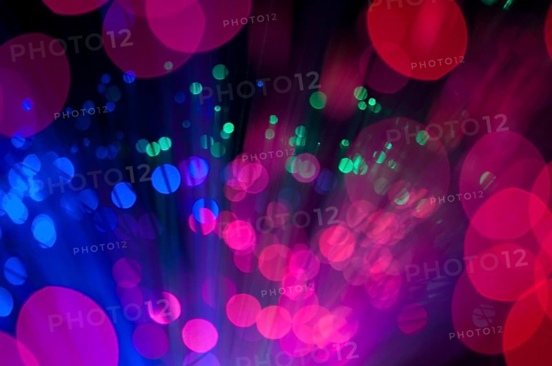 Blue and pink festive lights and circles background. Blurred christmas lights