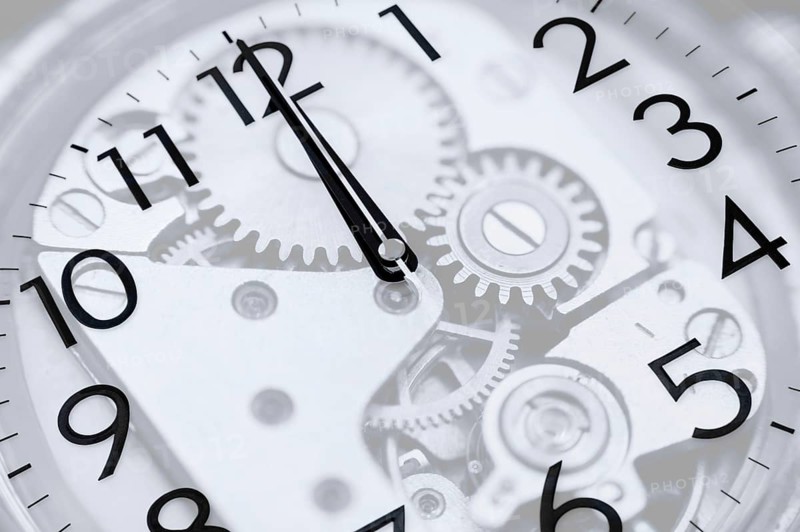 Twelve oclock (midnight or midday) on clock, double exposure