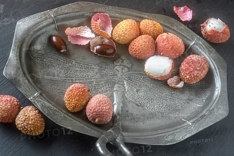 Lychees on an Art Nouveau plate (pewter)