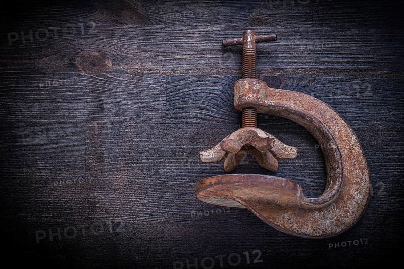 Old clamp on vintage wood board