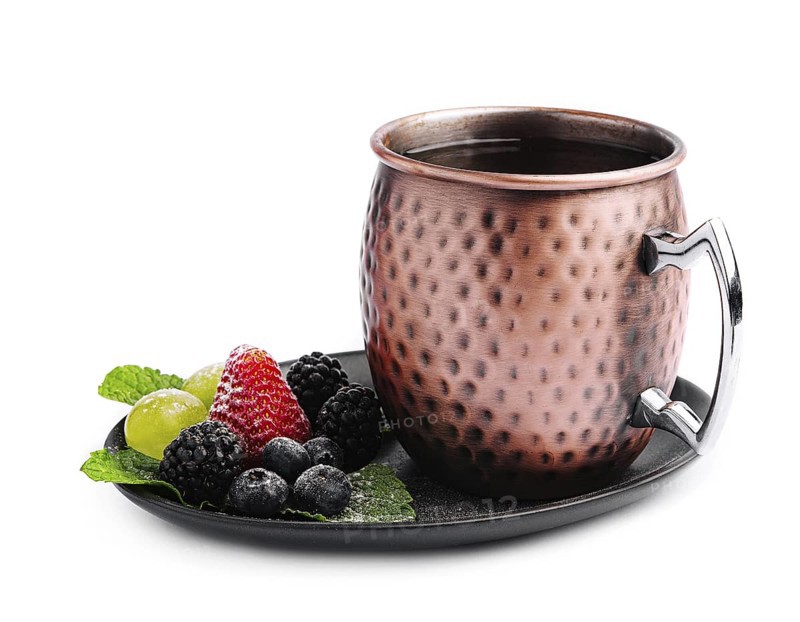 food still-life, Metal camp mug with tea with berries