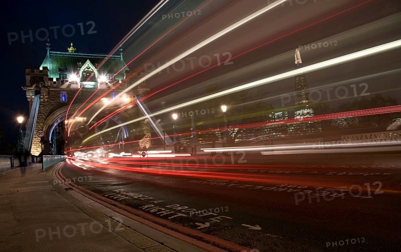 London, UK, December 10, 2015: London Tower Bridge, UK, at night with cars and buses leaving colorful light traces