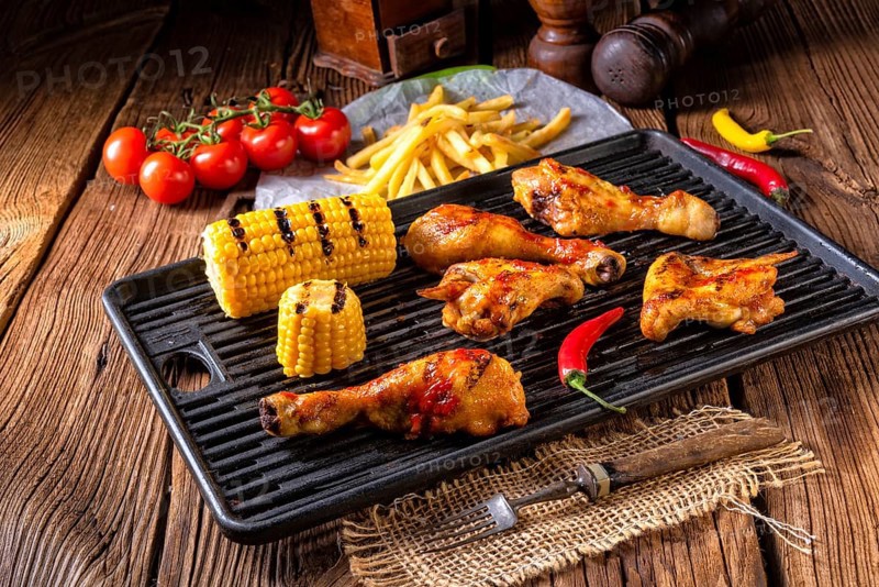 Rustic Grilled chicken wings, legs, and spicy corn