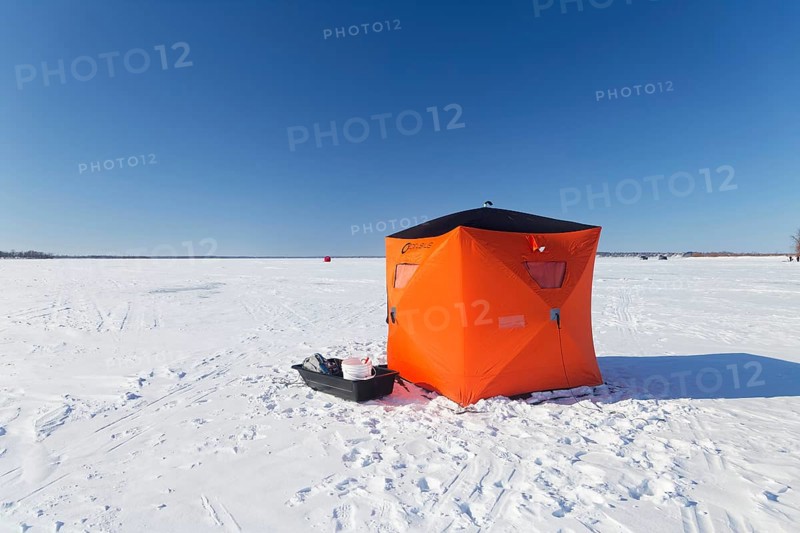 Winter, icefishing tent on the frozen Saint Lawrence River, Province of Quebec, Canada