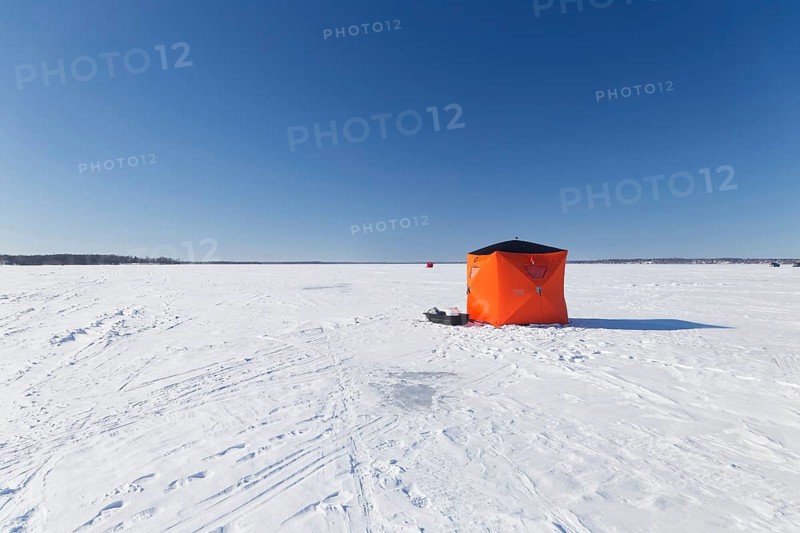 Winter, icefishing tent on the frozen Saint Lawrence River, Province of Quebec, Canada