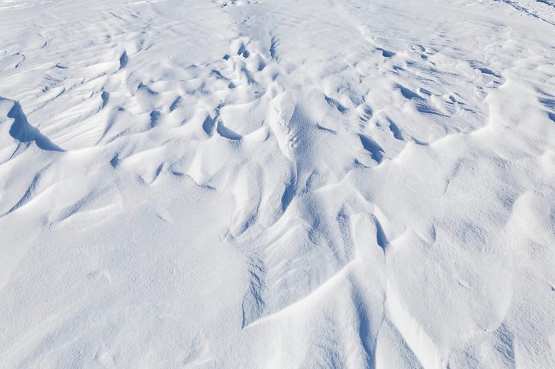 Winter, snowdrift pattern on a frozen river, Province of Quebec, Canada