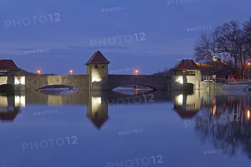 The illuminated Palmengarten weir in the blue hour. Leipzig, Saxony, Germany
