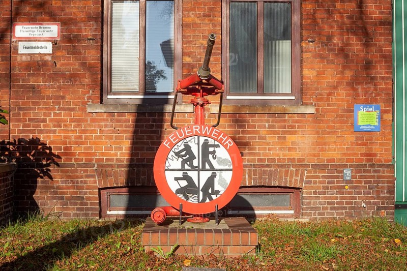 Fire brigade sign with fire pump in front of the building of the voluntary fire brigade in Bremen-Vegesack, Bremen-Nord, Bremen, Germany