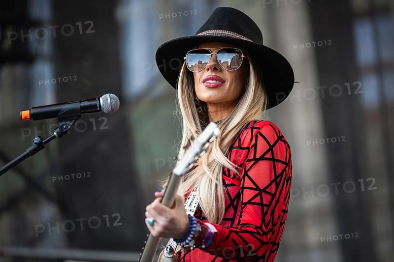 WROCLAW, POLAND - MAY 1, 2025: World Guitar Record concert, 8122 participants played Jimi Hendrix's song Hey Joe on guitars in the Wroclaw market square. Woman guitarist Orianthi