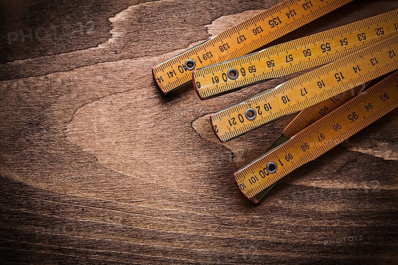 Wooden meter on wood board horizontal image construction concept