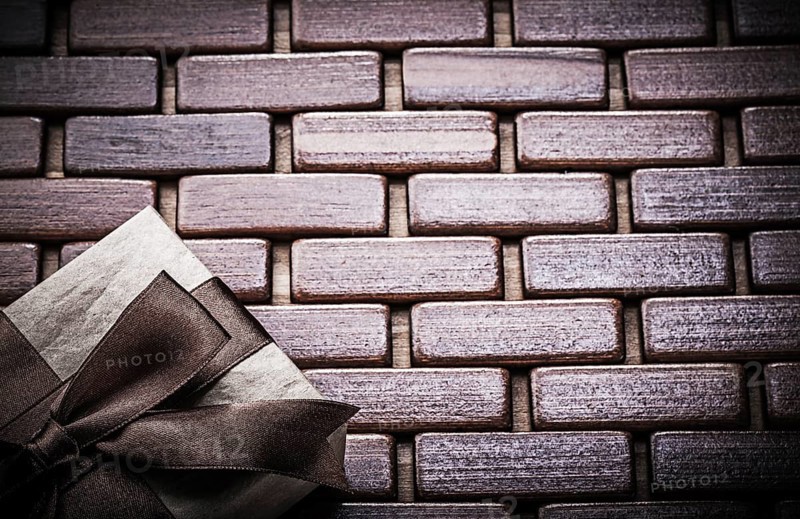 Packed gift box on wooden wicker matting holidays concept