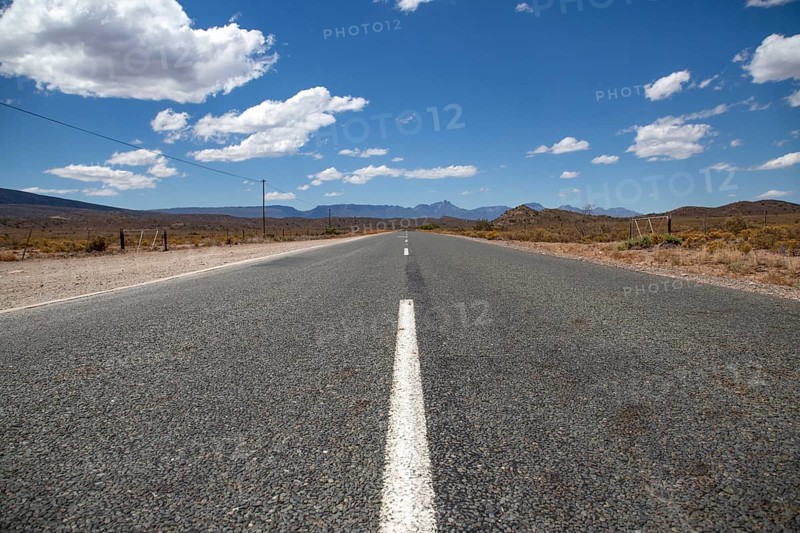 Endlessly straight road in the vastness of Africa