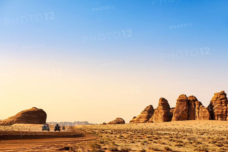 Vintage Land Rover Tour in the rocky landscape of Hegra, Unesco World Heritage Site Al Ula, Kingdom of Saudi Arabia